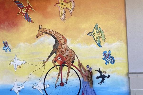 Giraffe On A Unicycle Mural